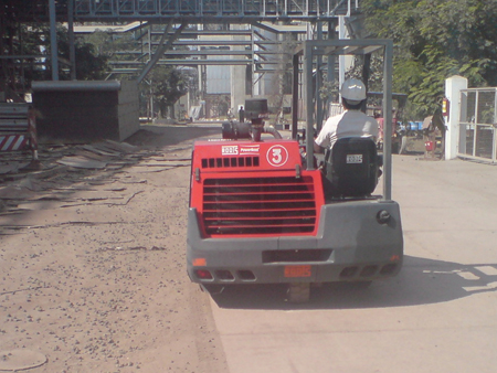 Powerboss 9X ride on sweeper in action