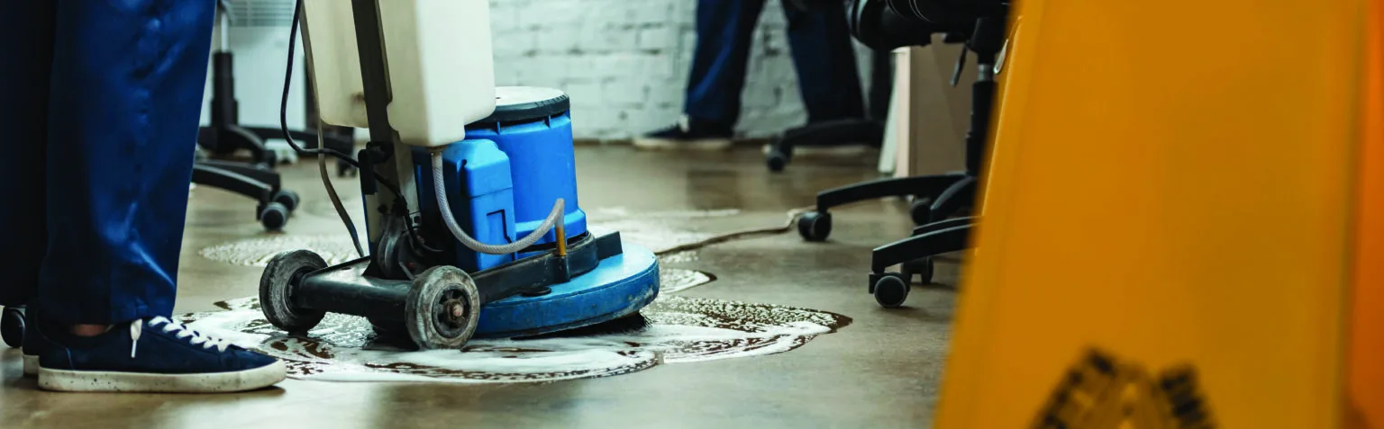 Industrial cleaning chemicals and floor scrubbing equipment in a facility